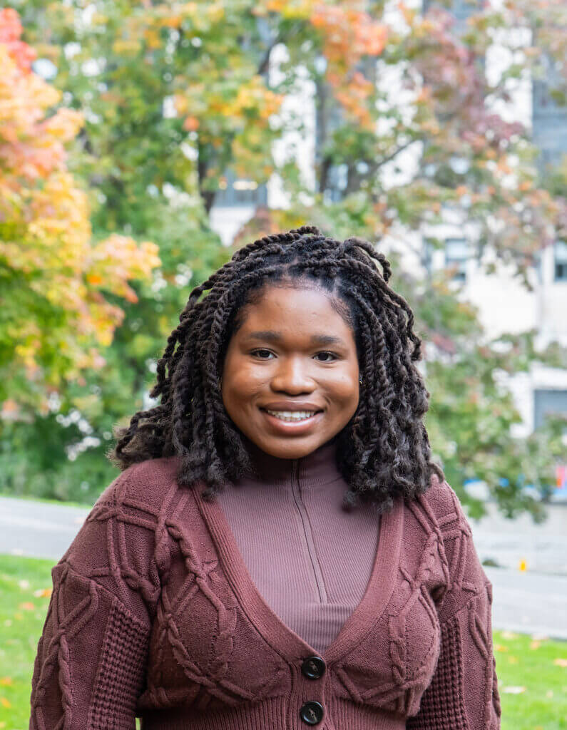 Odu, female student smiling outdoors