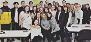 Group of smiling students from the Hospitality and Tourism program posing for the camera