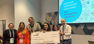 group shot of Algonquin College students holding a large cheque