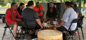 drummers in a circle mark National Indigenous Peoples Day at Pembroke campus