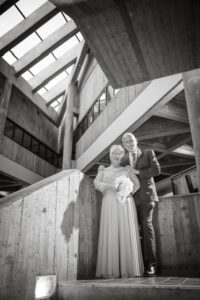 Diane and Mark pose for a photo in B building at Algonquin College's Ottawa Campus on their wedding day.
