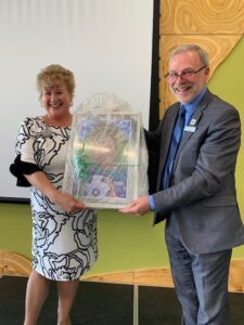 Diane McCutcheon, Vice President, Human Resources receives Lifetime Achievement Award from Algonquin College President and CEO Claude Brulé at retirement celebration on June 12, commemorating 34 years of service. 