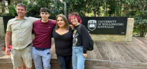 Algonquin College students pose in front of the Wollongong campus sign on an exchange trip to Australia