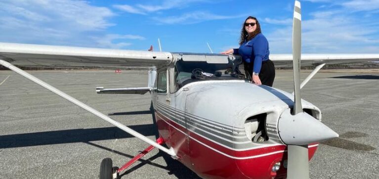 Algonquin College aviation management alumna Cailyx Madensky pictured with small aircraft.