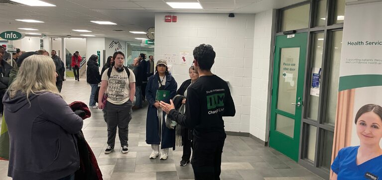 A student ambassador leads a campus tour at Algonquin College.