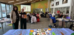 Kerry Potts and Courtney Scott in foreground with participants in Tea, Teaching and Bannock learning session in Nawapon.