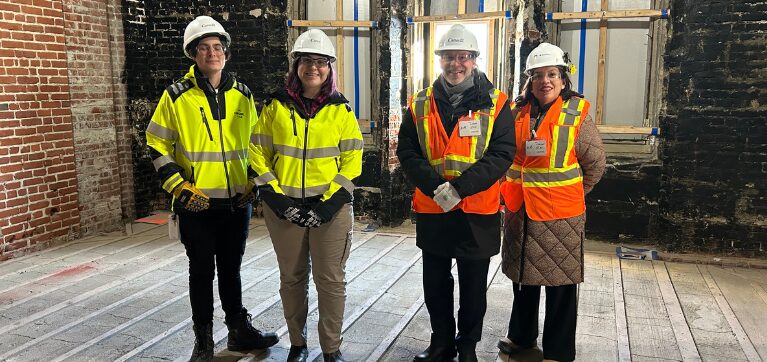 Two Algonquin College alumni meet with Claude Brule and Anita Tenasco who toured the Parliament Hill renovation