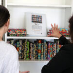 Truth and Reconciliation Art Installation 2024 - bookshelf with wrapped books