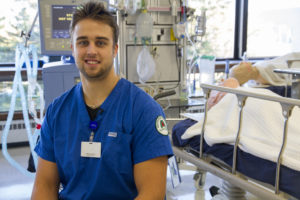 respiratory therapy student in the respiratory therapy lab with equipment