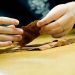 Student working with paper artifact