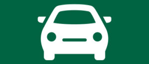 white car icon facing headlights on green background