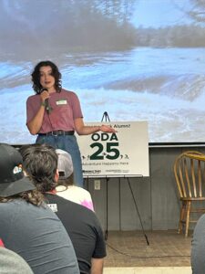 Algonquin College alumna Abigail Dunford speaks to a group of Outdoor Adventure graduates.