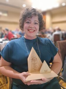 Forestry alumna Sionaid Eggett poses for a picture with award.