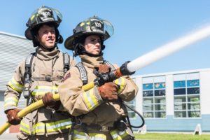 Fire students operating hose