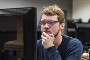 student working at a desktop computer