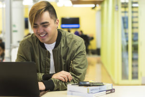 student working on a laptop