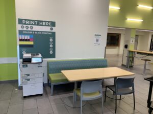 Image of a Ricoh multi-function printer in A building first floor near the Tim Hortons.