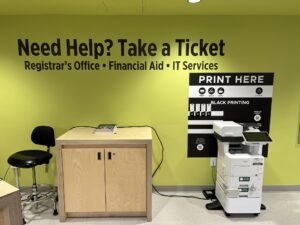 An image of a Ricoh multi function printer located on the lower level of C building in the student welcome center.