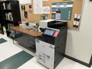 An image of a Ricoh multi function printer on the first floor of M building.