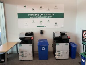 An image of two Ricoh multi function printers located on the third floor of C building, in the Library Print Copy Scan room.